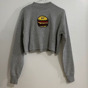 A cropped sweatshirt with a burger patch!